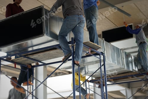 Preview: Workers are helping to raise the cool air duct of the air conditioning system to install