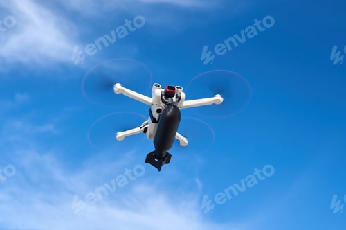Preview: A civilian drone with a small bomb on board is flying in the sky