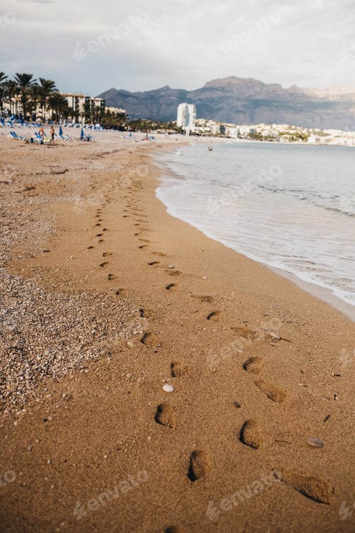 Preview: Footprints on sand near sea