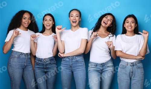 Preview: Smiling Women in T-shirts Standing on a Blue Background