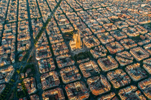 Preview: Aerial view of Barcelona Eixample residential district and Sagrada Familia Basilica at sunrise
