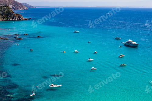 Preview: Amazing tropical panoramic view of turquoise gulf bay, sandy beach, green mountains and plants.
