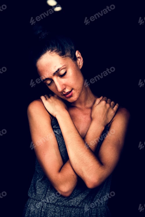 Preview: Woman hugging herself