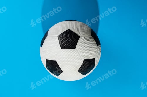Preview: Composition of football on blue background with copy space