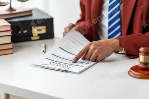 Preview: Business man hands close up working with contract lawyers specialize in dealing with legal issues