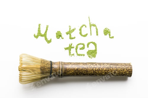 Preview: Tea match lettering with a whisk on a white background. Top veiw.