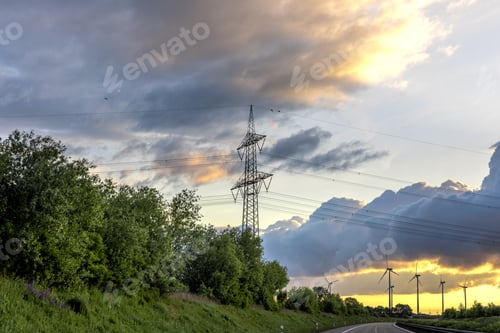 Preview: Power line tower at sunset. Electricity pylon. Energy grid infrastructure.
