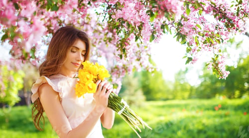 Preview: Spring Style. Beautiful Young Brunette Woman In Nice Spring Dress With A Bouquet Of Tulips.