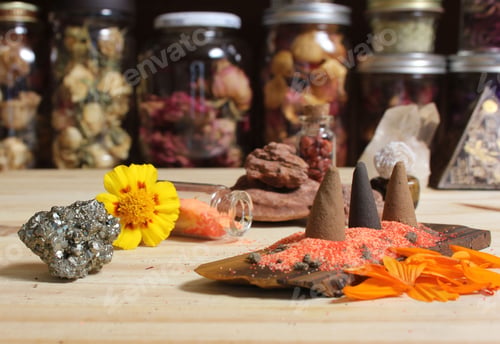 Preview: Close-up shot of incense cones on a stone slab with flowers.