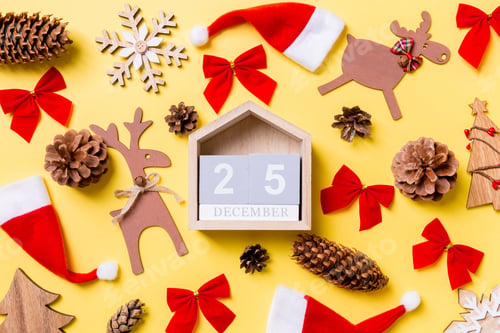 Preview: Christmas yellow background with holiday toys and decorations. Top view
