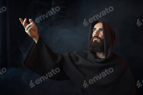 Preview: Thoughtful Man with Beard in Dark Robe