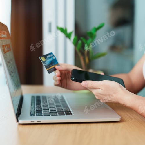 Preview: woman hand holding credit card and using laptop