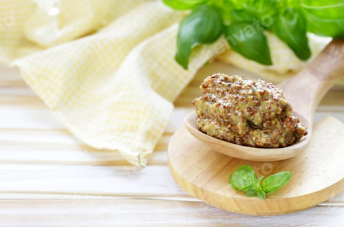 Preview: Dijon mustard dressing in a wooden spoon