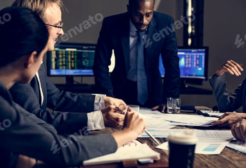 Preview: Group of entrepreneur analysing for investment in meeting room