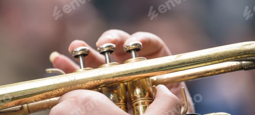 Preview: Musician with brass trumpet plays classical music. Close up view with details, blurred background,