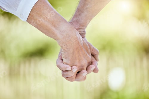 Preview: Cropped shot of a senior couple holding hands while spending time outdoors