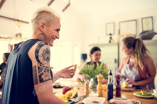 Preview: Group of friends are cooking in the kitchen