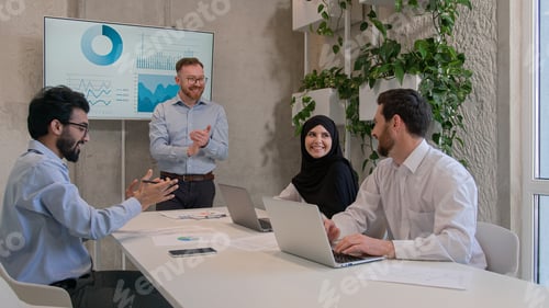 Preview: Happy diverse business people multiracial team businessmen muslim businesswoman in hijab group