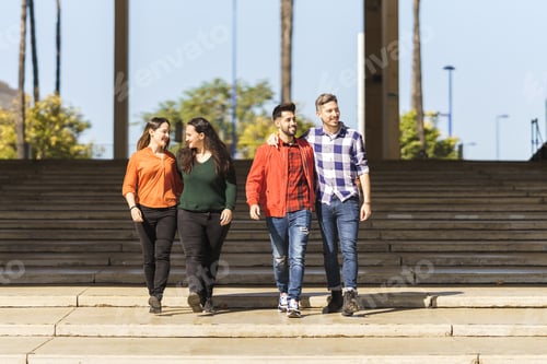 Preview: a lesbian and a gay couple walk down the steps of a plaza