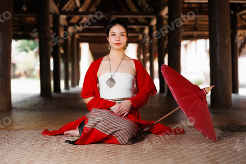 Preview: Northern Thai Chiangmai lanna style beautiful women with paper umbrella at wat ton kwen