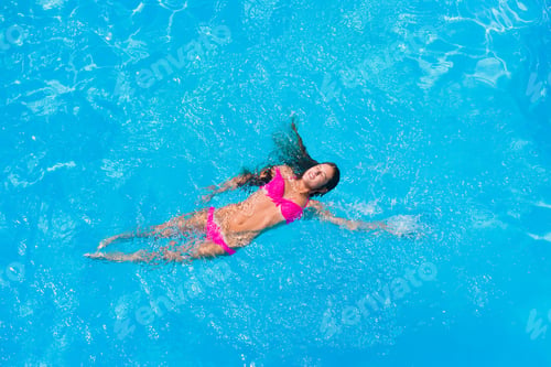 Preview: A girl is relaxing in a swimming pool
