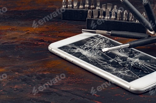 Preview: Smartphone repair concept. Damaged display of smartphone and tools
