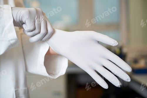 Preview: Medical Professional Putting on Sterile Protective Gloves