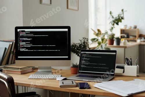 Preview: Workplace of modern IT programmer with desktop computer and laptop