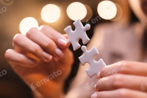 Preview: Business person team work holding jigsaw to connecting successful puzzle piece for matching