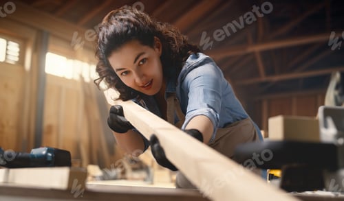 Preview: carpenter is working in workshop