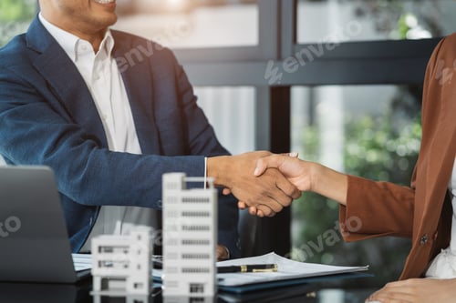 Preview: Close up shake hands, Considering buying a home, investing in real estate.