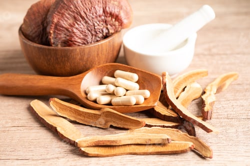 Preview: Dried lingzhi mushroom with capsule drug, alternative medicine herbal organic herb.