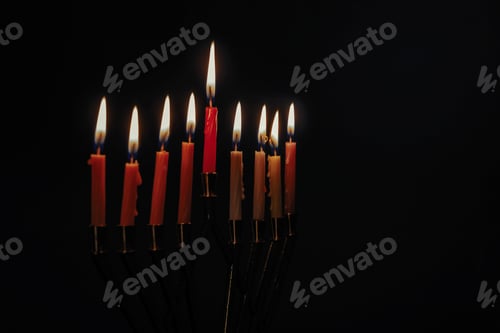 Preview: Colorful candles lite on the traditional Silver Hanukkah menorah black background