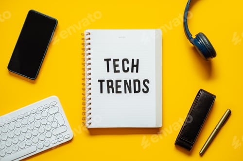 Preview: Tech trends, Top New Technology Trends. Word trends on open notepad with different gadgets and