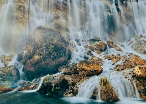 Preview: Scenic Waterfall Flowing Over Rocks and Boulders