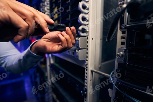 Preview: Technician attaching mounted hardware component to front of server rack