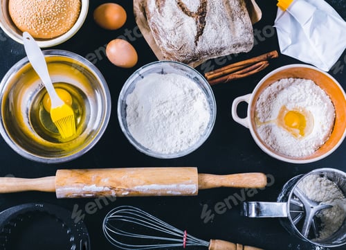 Preview: Ingredients and utensil for baking on the black board, top view