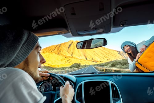 Preview: Young hitchhiker on the road and man driving