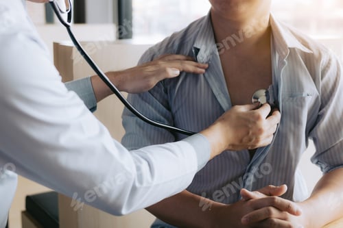 Preview: Asian doctor is using a stethoscope listen to the heartbeat of the elderly patient.