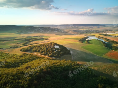 Preview: Aerial fields and meadow in mountain.