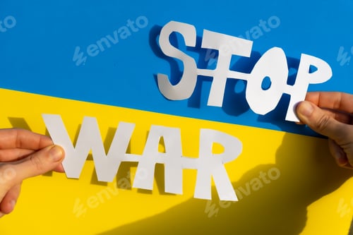 Preview: Stop war, conflict between Ukraine and Russia. Hands of a woman holding an anti war symbol