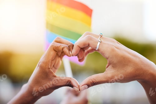 Preview: LGBTQ, pride flag and hands with a heart sign for love, equality and solidarity of a gay couple. Ra