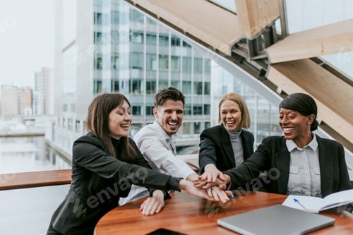 Preview: Diverse happy business people joining hands