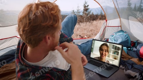 Preview: Outdoors man talking webcam on mountains trip closeup. Smiling girl talk laptop
