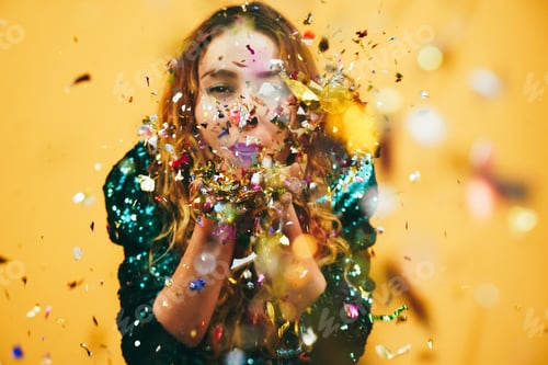 Preview: happy girl blowing confetti holding vintage disco ball - Focus on hands holding confetti
