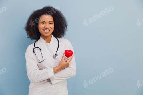 Preview: African American doctor holding heart symbol heart care