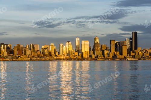 Preview: The Setting Sun Is Reflected From The Skyscrapers In The Seattle Skyline.