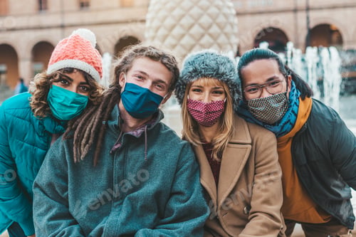 Preview: Multiracial people covered by face mask looking at camera
