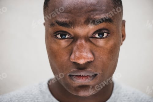 Vista previa: Close up serious African american man staring with blank expression on face