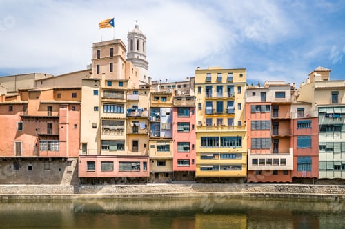 Preview: Beautiful view of the colorful buildings by the harbor captured in Girona, Catalonia, Spain